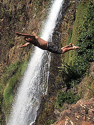 diving into the pool below  the El Cora waterfall